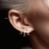 Pair of Implant Grade Titanium Threadless Stud Pink Bezel Earrings with Flat Back